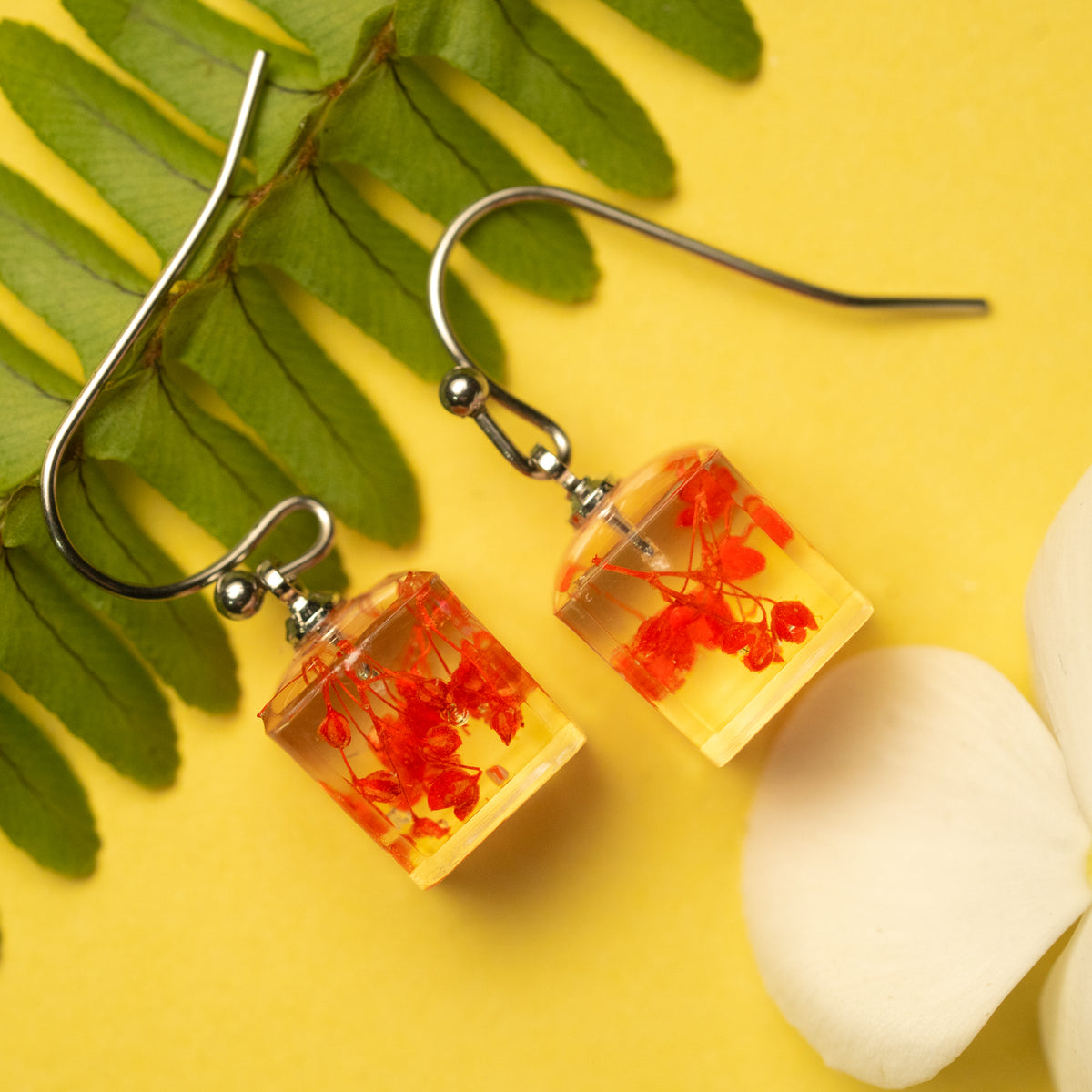 Radiant Love: A Red Flower's Glow in a Light Box Earring